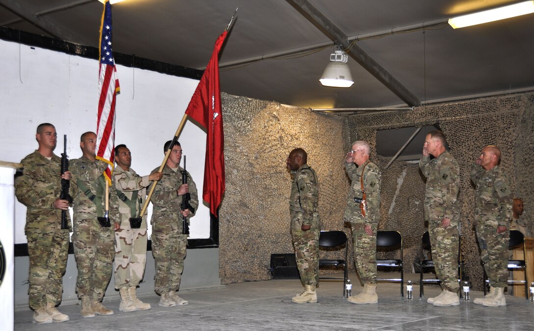 KANDAHAR AIRFIELD, Afghanistan — (From left) Col. Vincent Quarles, incoming commander U.S. Army Corps of Engineers Afghanistan District - South, Maj. Gen. Michael Eyre, USACE Transatlantic Division commanding general, Air Force Col. Benjamin Wham, outgoing AED-South commander and Command Sgt. Maj. Lorne Quebodeaux, district command sergeant major, render honors during change-of-command ceremonies here, July 12, 2012.
