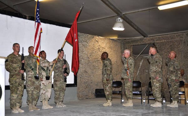 KANDAHAR AIRFIELD, Afghanistan — (From left) Col. Vincent Quarles, incoming commander U.S. Army Corps of Engineers Afghanistan District - South, Maj. Gen. Michael Eyre, USACE Transatlantic Division commanding general, Air Force Col. Benjamin Wham, outgoing AED-South commander and Command Sgt. Maj. Lorne Quebodeaux, district command sergeant major, render honors during change-of-command ceremonies here, July 12, 2012.