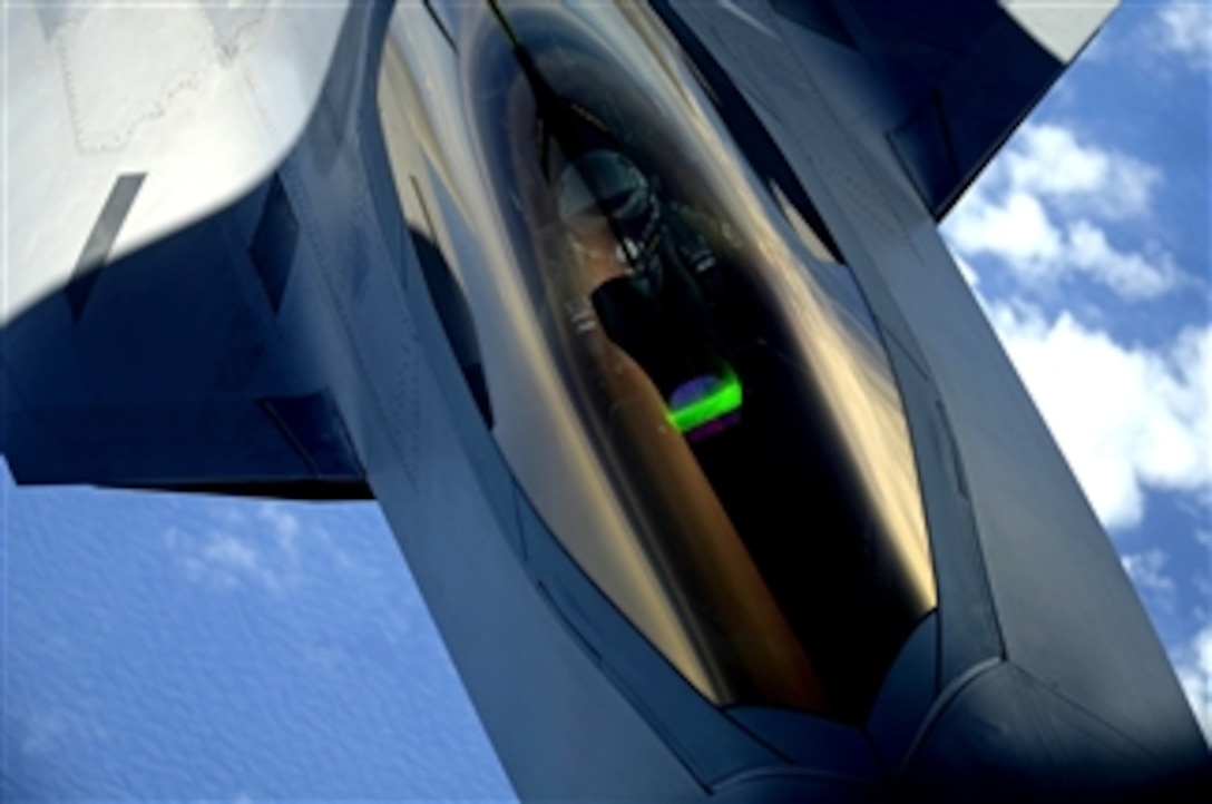 A U.S. Air Force F-22 Raptor aircraft with the 1st Fighter Wing receives a midair refueling from a KC-135 Stratotanker aircraft assigned to the 756th Air Refueling Wing over Joint Base Andrews Maryland on July 10, 2012.  