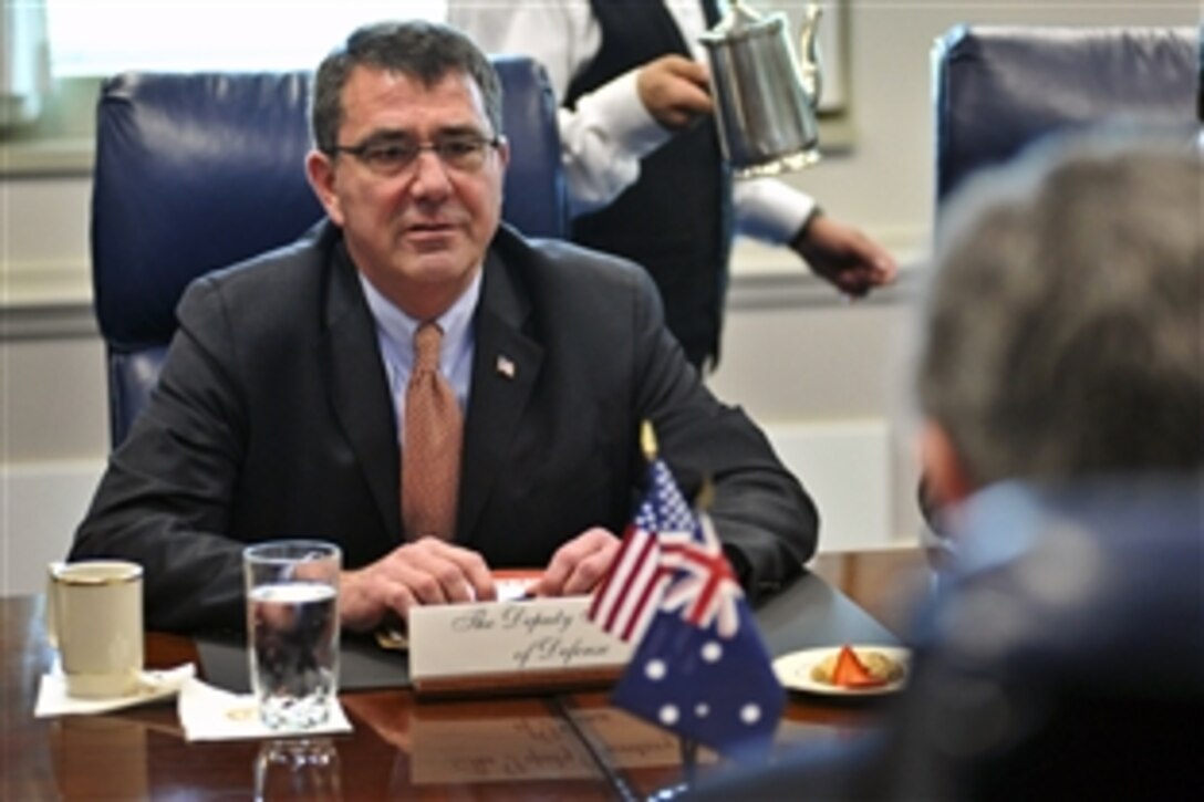 U.S. Deputy Defense Secretary Ashton B. Carter, left center, meets with Australian Defense Secretary Duncan Lewis, right center, at the Pentagon, July 13, 2012. The two leaders met to discuss areas of mutual defense interest.