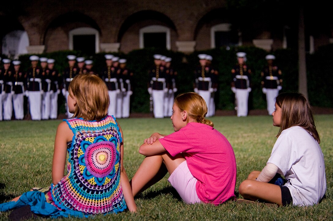 Spectators watch the Friday Evening Parade at Marine Barracks Washington July 13.