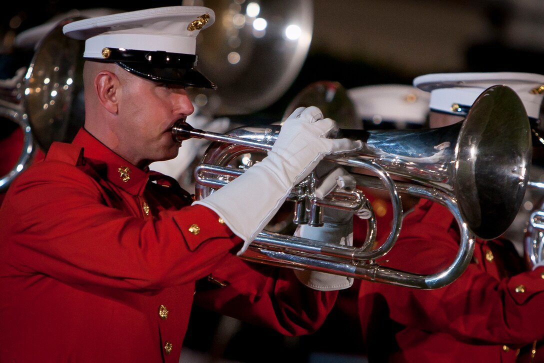 Staff Sgt. Ralph Galyean III, a U.S. Marine Drum & Bugle Corps bugler, performs during a Friday Evening Parade at Marine Barracks Washington July 13.