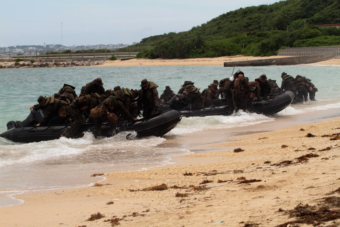 WHITE BEACH, Okinawa, Japan – Combat Rubber Raiding Craft from Company E., Battalion Landing Team 2nd Battalion, 1st Marine regiment, 31st Marine Expeditionary Unit, come ashore during boat raid training here, July 11. The raid was part of a pre-deployment training package. The 31st MEU is the United States force in readiness for the Asia Pacific region. 