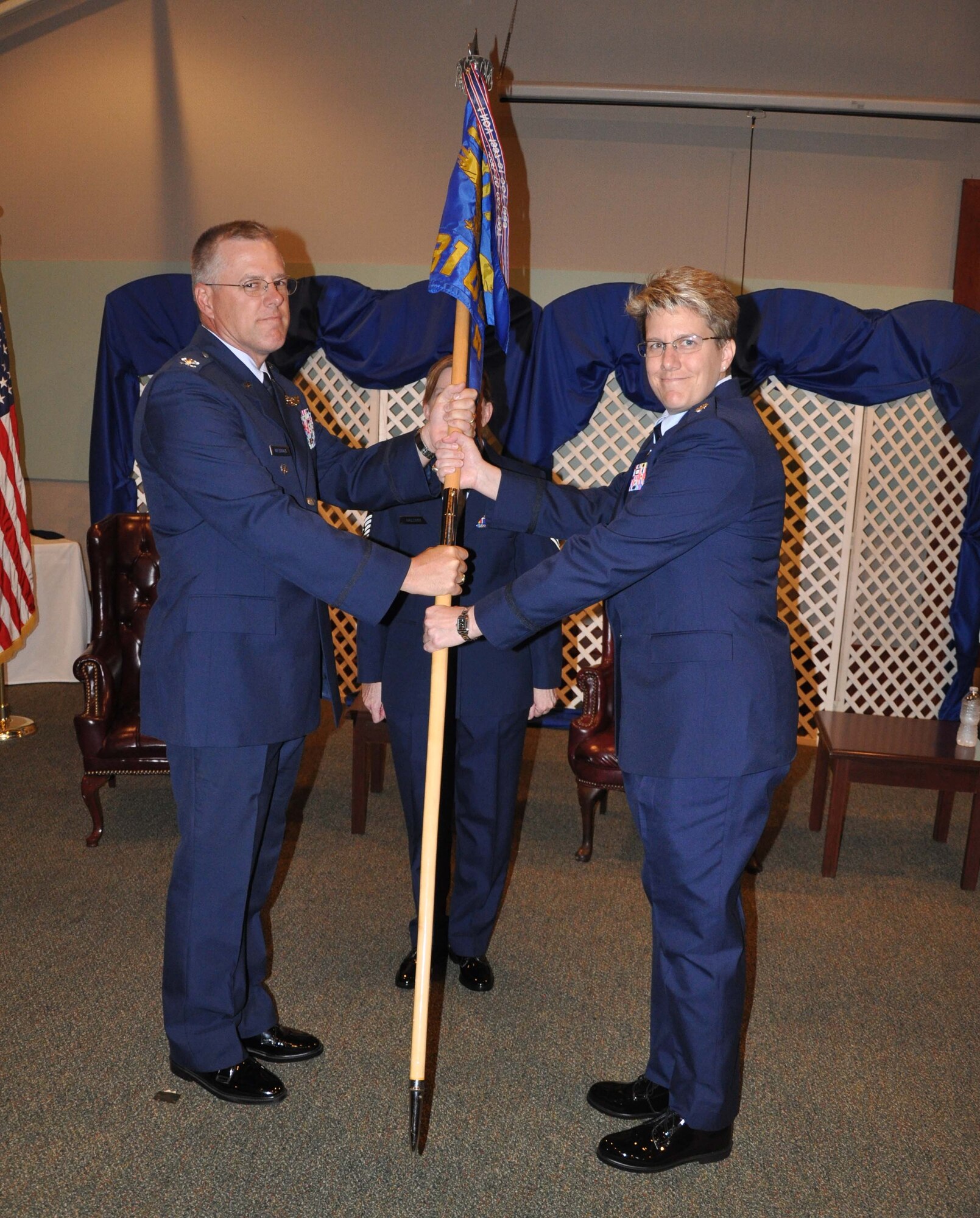 Col. Paul R. Wietbrock, deputy commander of the 931st Air Refueling Group, presents
the 931st Operations Support Squadron guidon to Lt. Col. Stacy A. Wharton, the new
commander of the 931st OSS, during a change of command ceremony at McConnell Air Force Base, Kan., July 14. Wharton assumed command of the 931st OSS,
taking the place of outgoing commander, Lt. Col. Barry K. Jones. (U.S. Air Force photo
by Staff Sgt. Carrie M. Peasinger)
