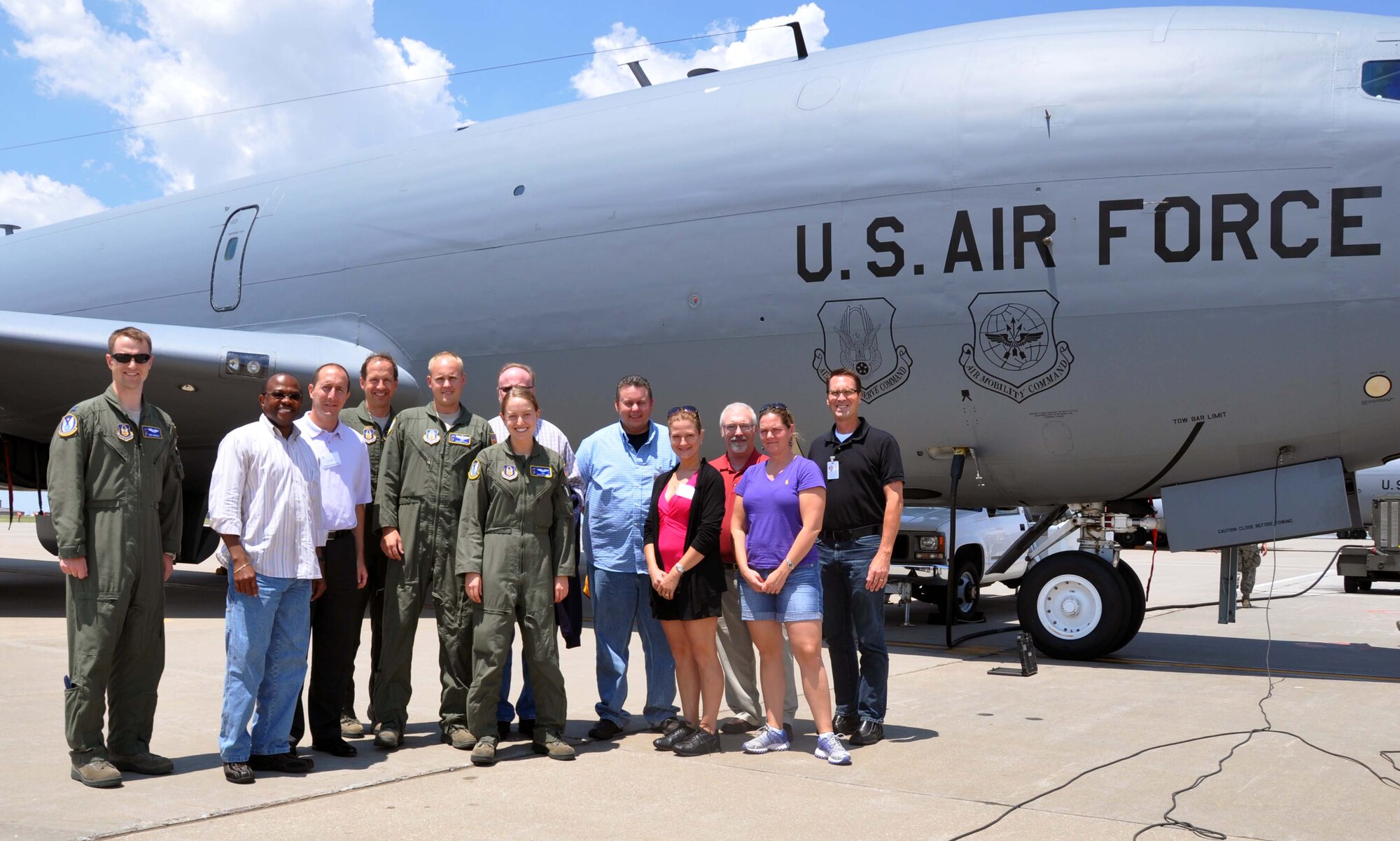 A collection of McConnell Air Force Base Honorary Commanders pose with an aircrew from the 18th Air Refueling Squadron, 931st Air Refeuling Group, McConnell Air Force Base, Kan., following an orientation flight.  During the flight, the Honorary Commanders were able to observe air refueling training from the refueling boom pod of a KC-135 Stratotanker.  The McConnell Air Force Base Honorary Commander program pairs local civic leaders with commanders from both the active duty 22nd Air Refueling Wing and the Reserve 931st Air Refueling Group at McConnell.  The purpose of the program is to foster strong relationships between leadership at the base and civilian leaders in the local area. (U.S. Air Force photo by 1st Lt. Zach Anderson)