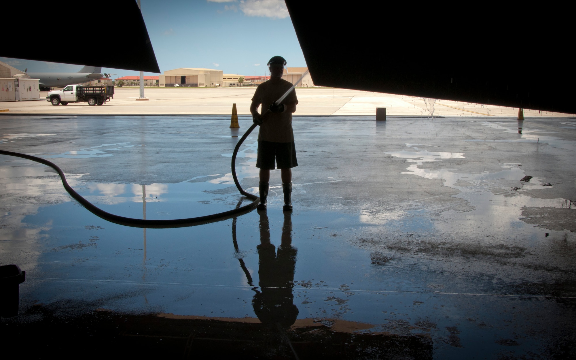 MACDILL AIR FORCE BASE, Fla. – When it’s over 90 degrees Fahrenheit on the flight line, the smart place to be is near the water.  Staff Sgt. Bryan Hartman, a crew chief with the 927th Air Refueling Wing’s Maintenance Squadron, spent his reserve weekend washing a 53 year-old plane in the shade of its wing.  The regular wash and critical corrosion inspection keeps the planes looking their best and ensures they can complete their missions. (Official U.S. Air Force photo/Staff. Sgt. Shawn Rhodes)
