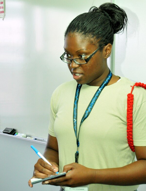 Latoya Gatewood-Young, a Development and Training Flight attendee and newly acquired 512th Airlift Wing member, takes role for the June D&TF assembly at Dover Air Force Base, Del. June 23. Recruits must partake in the monthly instruction weekends as part of enlistment into the inactive Reserve while awaiting positions to open in basic and technical training. (U.S. Air Force photo by Staff Sgt. Andria J. Allmond/Released)