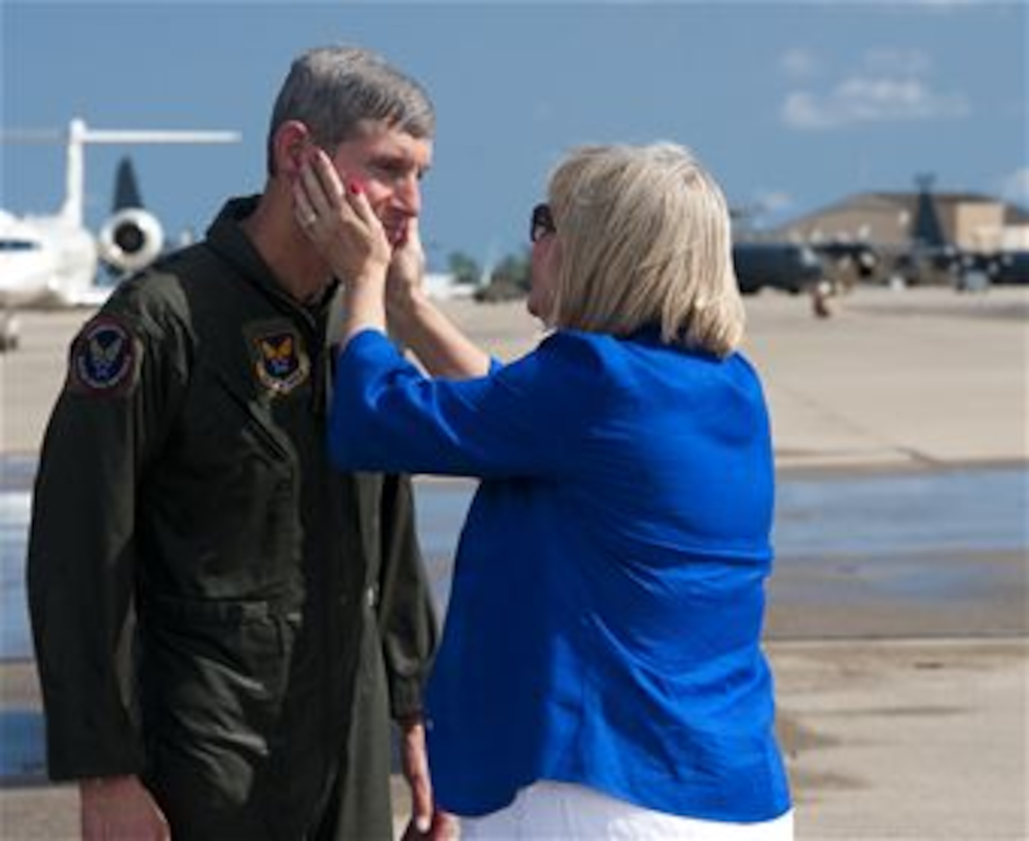 Air Force Chief of Staff Gen. Norton Schwartz is embraced by his wife Susie, following his last flight as an active duty officer on an MC-130E Combat Talon I, at Hurlburt Field, Fla., July 12, 2012. The MC-130E crew conducted a local training sortie during the mission. It also served as Schwartz's "fini flight" in the Air Force. (U.S. Air Force photo/Airman 1st Class Christopher Williams)