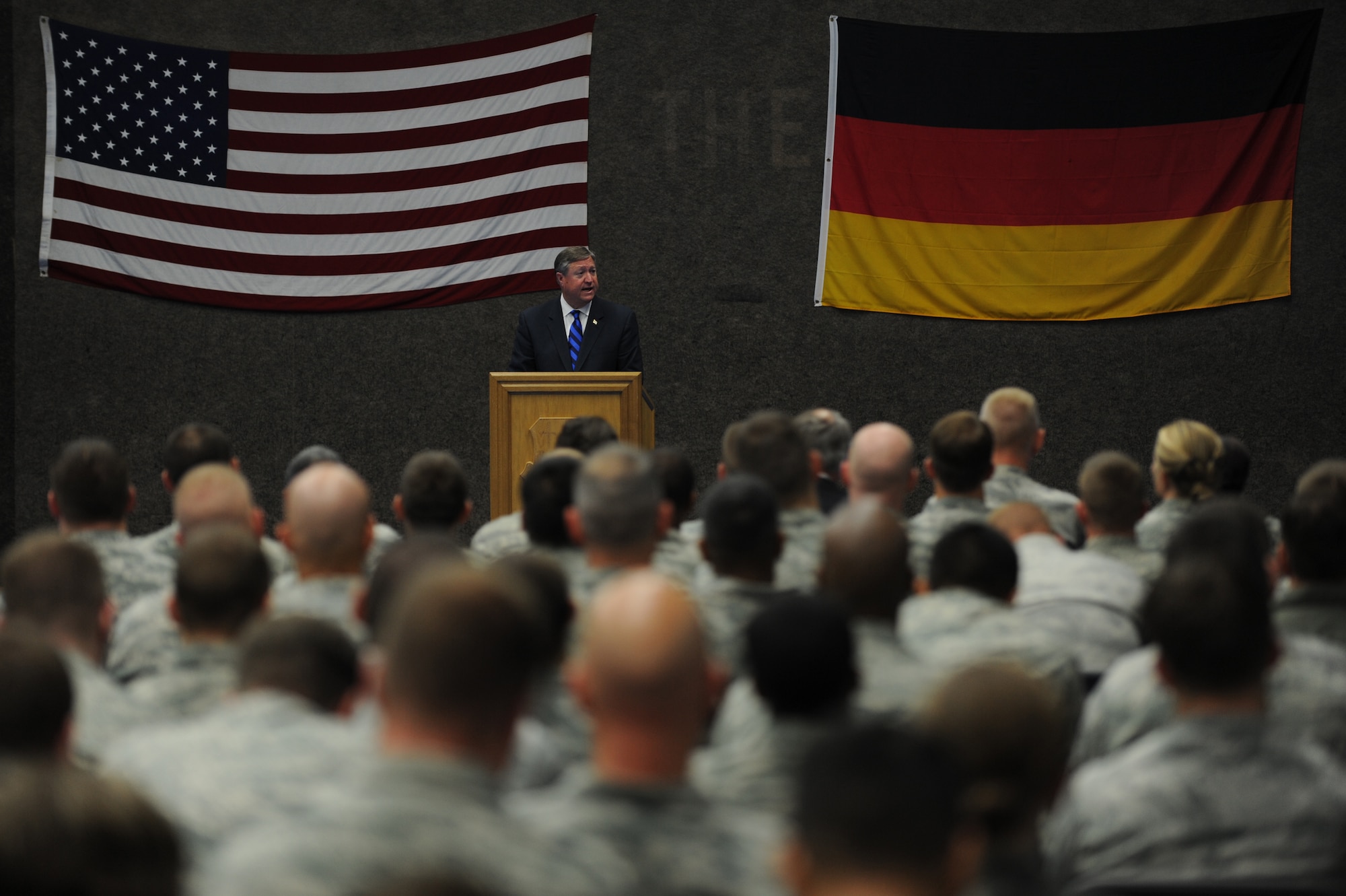 Secretary of the Air Force Michael Donley speaks to 52nd Fighter Wing Airmen during an Airmen’s Call at Spangdahlem Air Base, Germany, on July 13, 2012. During his visit, the secretary learned about the mission of the 52nd FW and the unique capabilities the base provides to the European theater of operations. (U.S. Air Force photo/Senior Airman Matthew B. Fredericks/Released)
