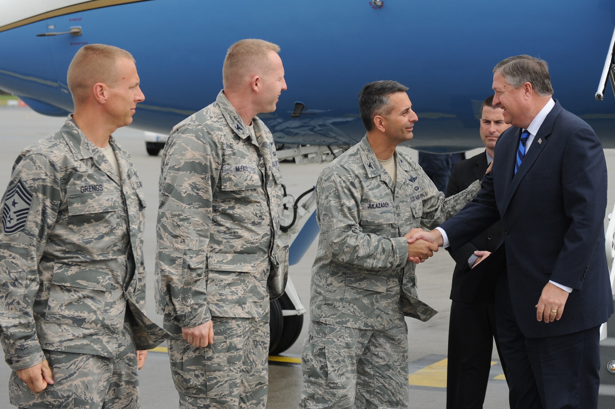 Col. David Julazadeh, 52nd Fighter Wing commander, greets Secretary of the Air Force Michael Donley upon his arrival at Spangdahlem Air Base, Germany, on July 13, 2012.  During his visit, the secretary learned about the mission of the 52nd FW and the unique capabilities the base provides to the European theater of operations. (U.S. Air Force photo/Senior Airman Matthew B. Fredericks/Released)