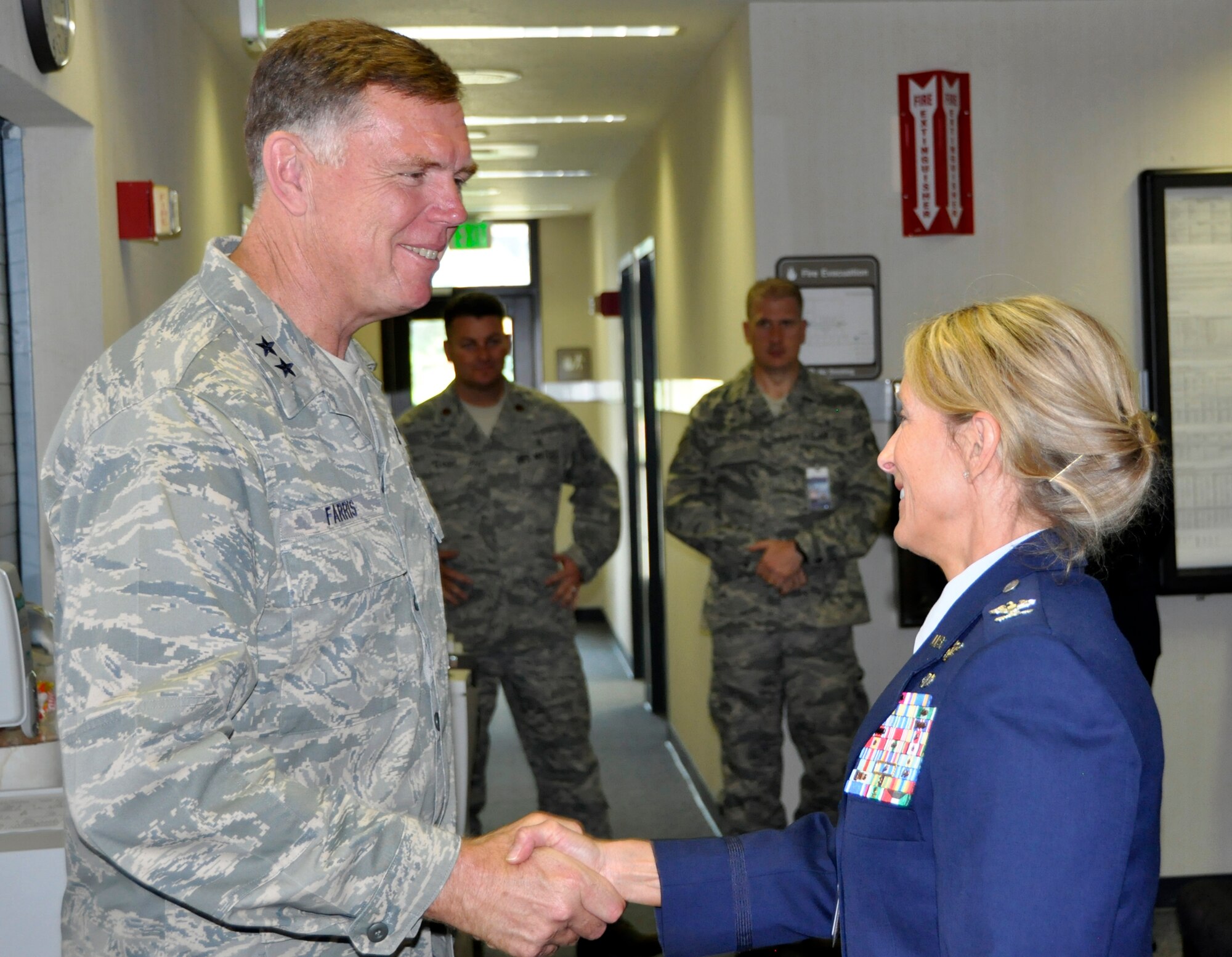 Air Force Reserve Col. Kathleen Flarity welcomes Maj. Gen. Wallace W. “Wade” Farris, Jr., 22nd Air Force commander, to the Peterson Clinic July 15 at Peterson Air Force Base, Colo. Farris visited the wing to see its mission firsthand as well as gain a better understanding of its involvement with the recent Modular Airborne Fire Fighting System, or "MAFFS" activation to battle the nearby Waldo Canyon Fire. The general also coined a number of Air Force Reservists who had gone above and beyond in their respective 302nd AW positions. Farris visited the wing July 14-17. Flarity commands the 302nd Aeromedical Staging Squadron. (U.S. Air Force photo/Tech. Sgt. Daniel Butterfield)