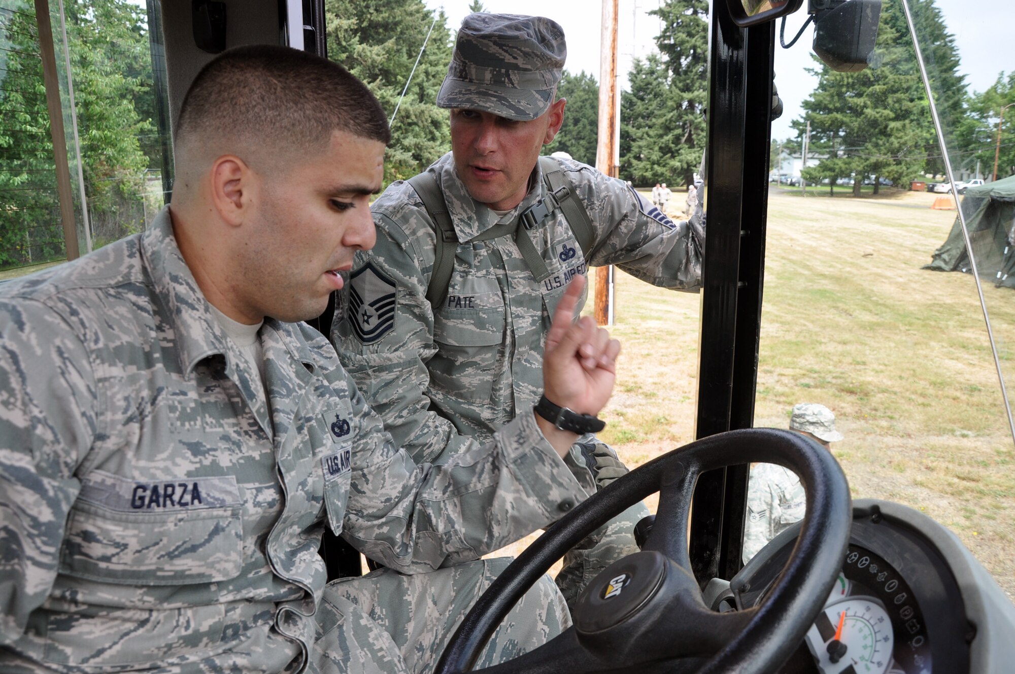 MCCHORD FIELD, Wash. - (Left to right) Tech. Sgt. Alfredo Garza, 446th Security Forces Squadron here, learns how to operate a 10K all terrain lifter from Master Sgt. Michael Pate, 446th SFS training NCOIC.  Reservists from the 446th SFS are preparing for the September Operational Readiness Exercise and October Operational Readiness Inspection during their Unit Training Assembly, July 14-15. (U.S. Air Force photo by Tech. Sgt. Elizabeth Moody)