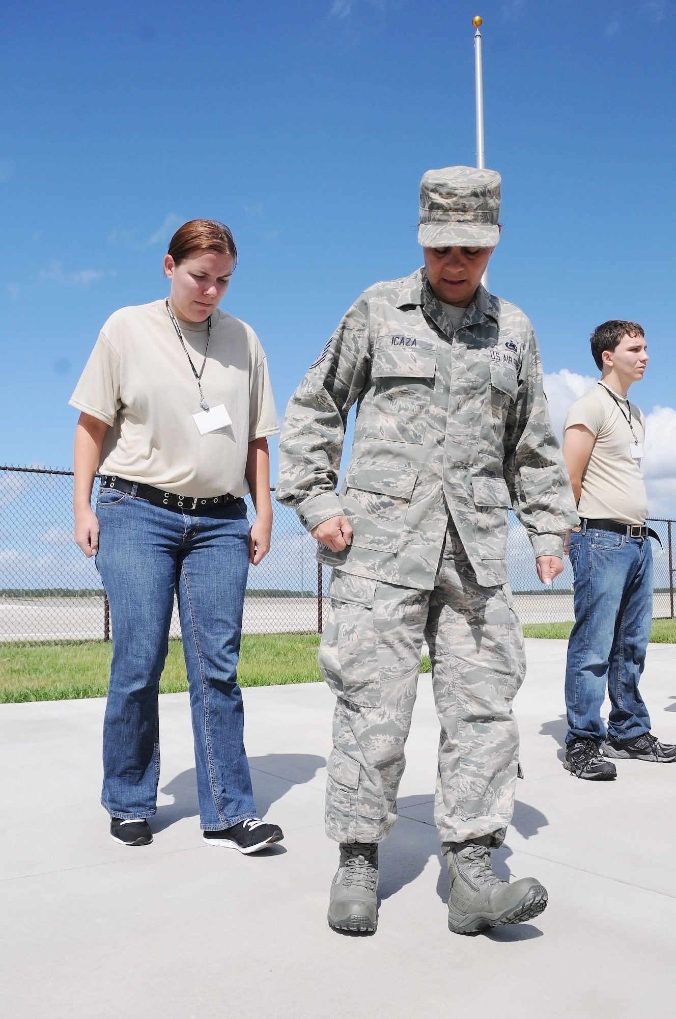 Staff Sgt. Eivette Icaza, 927th Logistics Readiness Squadron, instructs Erika Beck, from Safety Harbor, Fla., on the proper way to perform a facing movement July 14, 2012 at MacDill Air Force Base, Fla.  Beck is part of the 927th Air Refueling Wing's Development Training Flight, which prepares newly-enlisted Reserve members for Air Force basic military training.  