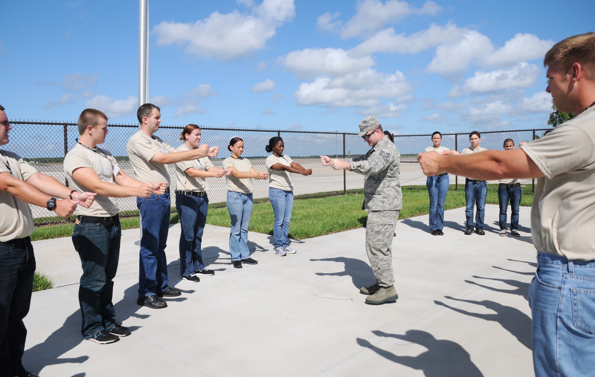 Members of the 927th Air Refueling Wing's Development Training Flight learn the proper way to stand at attention July 14, 2012 at MacDill Air Force Base, Fla. The Development Training Flight prepares newly-enlisted members for Air Force basic military training.  