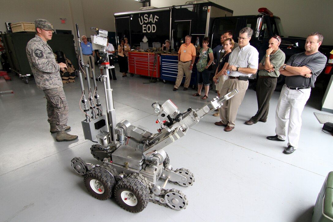 Master Sgt. David Pinkham demonstrates the capabilities of a remote-controlled robot to civilian employers during the annual Boss Day tour at the 932nd Airlift Wing.  Pinkham is an explosive ordnance disposal (EOD) specialist assigned to the 932nd Civil Engineer Squadron. Boss Day helps civilian employers better understand the Air Force Reserve mission and strenghens the employer-reservist relationship.  The 932nd AW is the only Air Force wing that flies the C-40C.  (U.S. Air Force photo/Tech. Sgt. Christopher Parr) 