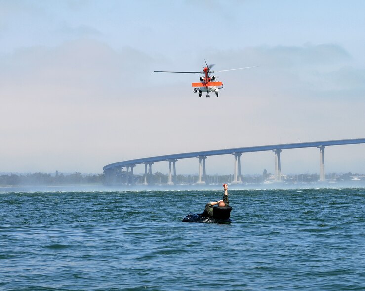 Maj. Peter Boeve, a pilot from the Air National Guard, Air Force Reserve Command Test Center waits to be extracted from the San Diego Bay during an exercise at the Naval Amphibious Base Coronado July 7. Boeve was one of many pilots who attended survival training to fulfill a tri-annual requirement. (U.S. Air Force photo by Tech. Sgt. Hollie A. Hansen)