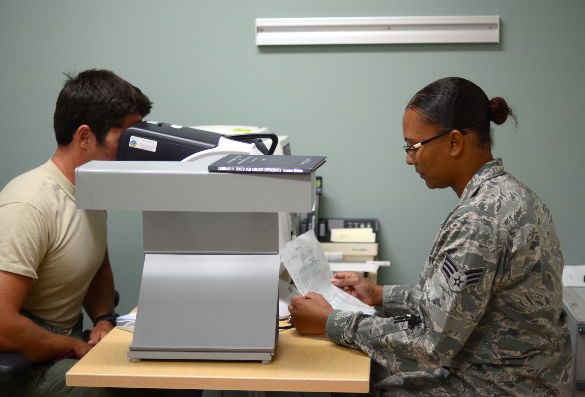 Senior Airman Naomi Parquette, 920th Aeromedical Staging Squadron, optometry technician, performs an eye exam on Senior Airman Tim Kline, 308th Rescue Squadron pararescueman. Kline was one of many Reservists who needed to have a flight physical during the Wing’s monthly Unit Training Assembly. Parquette is one of three Reserve optometry technicians who during UTAs, can see more than 30 Reservists in day. (U.S. Air Force photo/Senior Airman Natasha Dowridge)