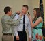 Brig. Gen. Kenneth L. Gammon, Chief of Staff, Utah Joint Force Headquarters Air, has his new rank pinned on by his son Kyle and daughter Gabriella, at his promotion ceremony at the Utah Air National Guard Base in Salt Lake City, on July 14, 2012. (U.S. Air Force photo by Tech. Sgt. Jeremy Giacolletti-Stegall)(Released)