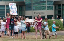 A Minnesota Air National Guard C-130 “Hercules” brings home about thirty Airmen from deployment to Southwest Asia on July 13, 2012 to the St. Paul Air Guard base, greeted by enthusiastic family and friends. Two more C-130 flights are scheduled over the next couple of days, each with about another thirty Airmen aboard, redeploying back to the 133rd Airlift Wing. USAF official photo by Tech. Sgt. Erik Gudmundson