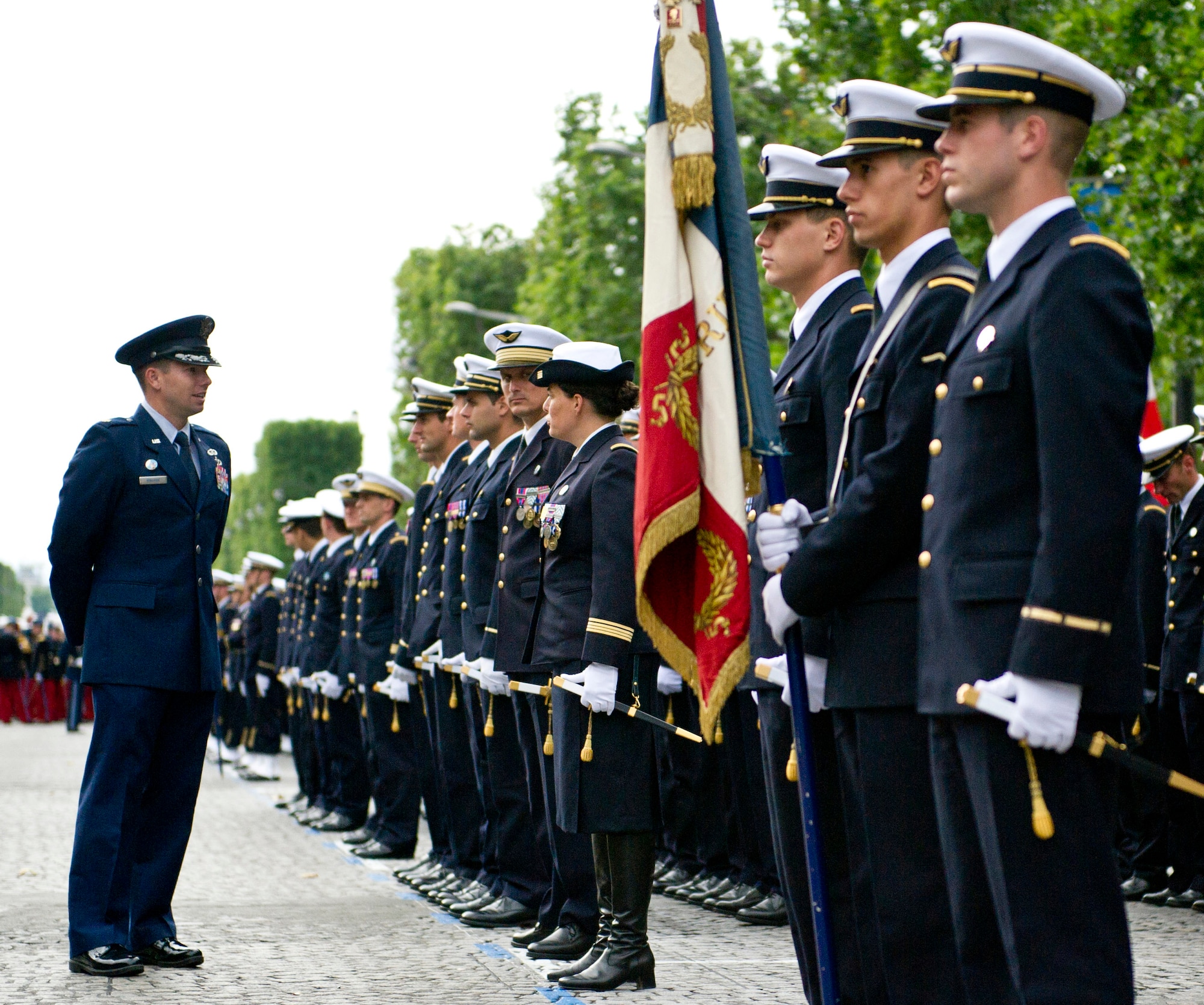 PARIS -- U.S. Air Force Maj. James Gingras, French Air Force Academy exchange officer, left, speaks with his cadets before marching in the 2012, 14th of July parade in Paris. The 14th of July, known in English by Bastille Day, is the French equivalent of the American 4th of July. It commemorates the attack on the Bastille on July 14, 1989, which preceded the French revolution. (U.S. Air Force photo/Staff Sgt. Benjamin Wilson)