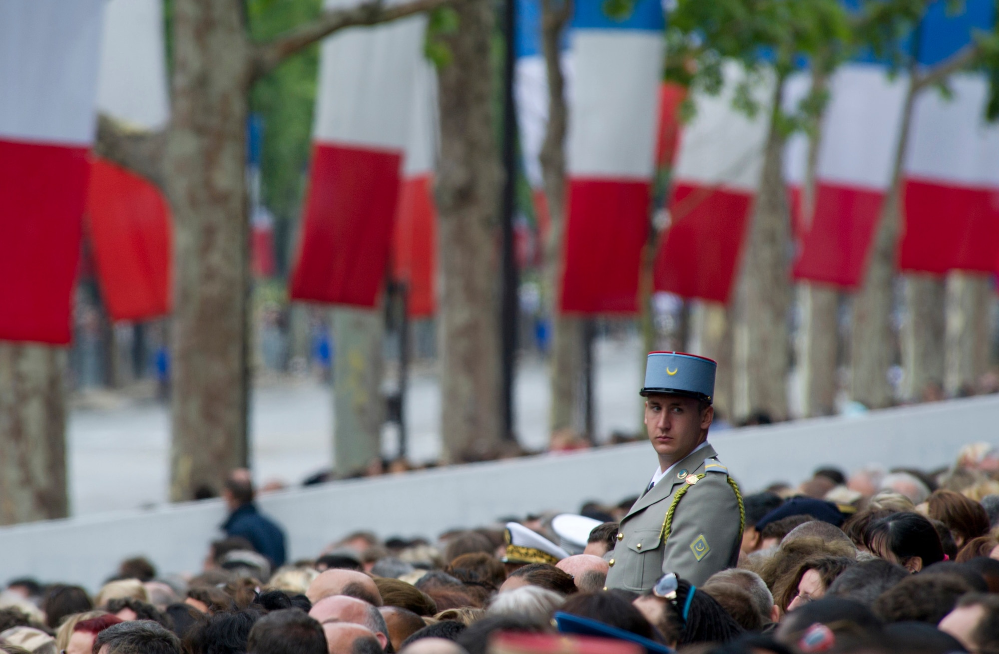 PARIS -- A French soldier guards the spectators? stands during the 2012, 14th of July parade in Paris. The 14th of July, known in English by Bastille Day, is the French equivalent of the American 4th of July. It commemorates the attack on the Bastille on July 14, 1989, which preceded the French revolution. (U.S. Air Force photo/Staff Sgt. Benjamin Wilson)