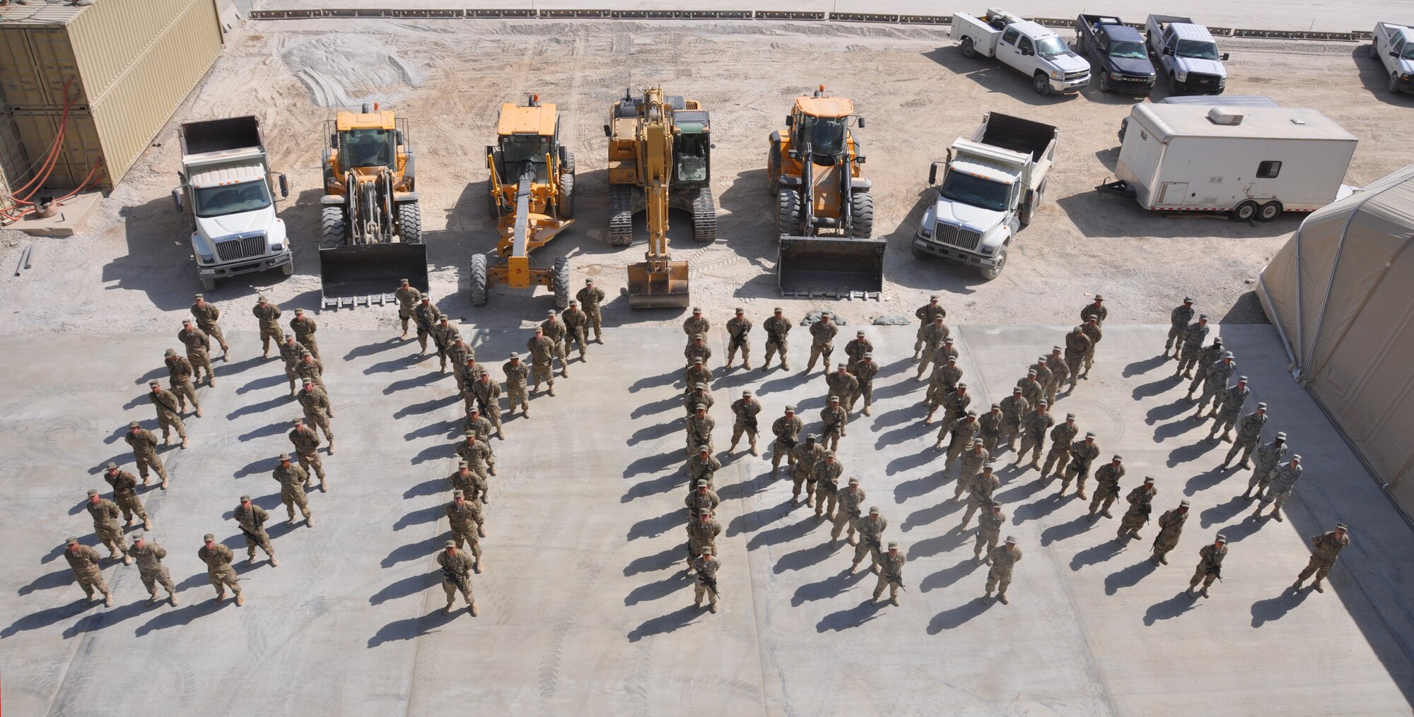 Members of the 577th Expeditionary Prime Beef Squadron spell the name "Dyrk" to contribute to the hometown "Dyrkstrong" effort. Four-year-old Dyrk Burcie was diagnosed with terminal cancer, and his father's fire department co-workers began an effort to bring as many smiles to the faces of Dyrk's family as possible. Lt. Col. Michael Nester, 577 EPBS commander, is a cousin of Dyrk's Dallas-Fort Worth, Texas, family. (U.S. Air Force photo/TSgt Shawn David McCowan)