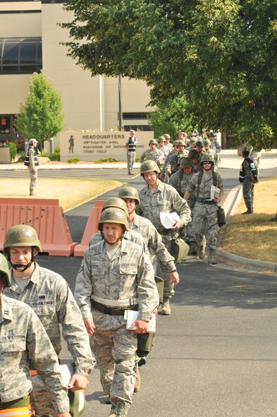 Airmen train to deploy during the Operational Readiness Inspection at Truax Field in Madison, Wis., June 14. As part of the ORI, the 115th Fighter Wing was evaluated on command and control, deployment processing, employment readiness, information operations and force protection.  (U.S. Air Force photo by Senior Airman Ryan Roth) (Released)

