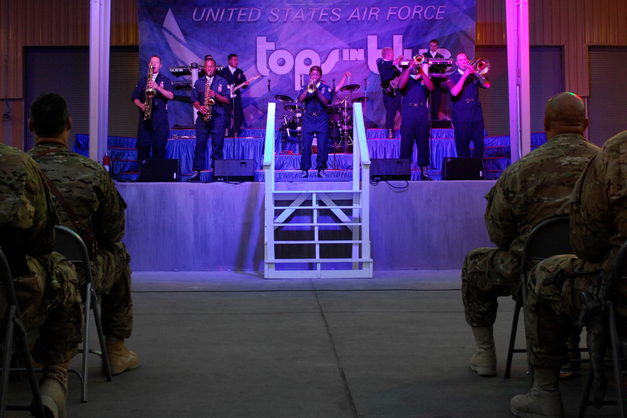 Members of U.S. Air Force musical group “Tops In Blue” perform the song “Frankenstein,” by the Edgar Winter Group, for personnel at Bagram Airfield, Afghanistan, July 13, 2012. Founded in 1953, “Tops In Blue” has performed at NASCAR events, during NBA finals, and during the halftime shows of Super Bowls XIX and XLV. (U.S. Air Force photo/SSgt. Jeff Nevison)