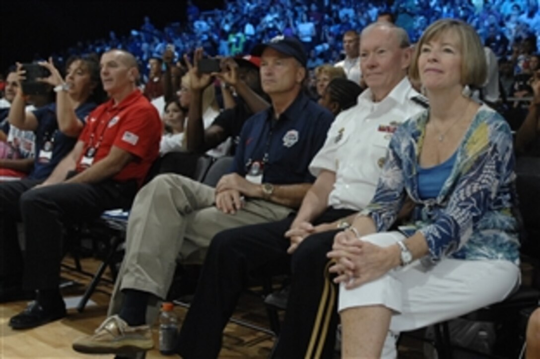 Army Gen. Martin E. Dempsey, second from right, chairman of the Joint Chiefs of Staff, his wife, Deanie, to his right, Navy Adm. James A. Winnefeld Jr., near left, vice chairman of the Joint Chiefs of Staff, and Marine Corps Sgt. Maj. Bryan B. Battaglia, senior enlisted advisor to the chairman, far left, watch the USA Basketball men’s national team scrimmage at the District of Columbia National Guard Armory in Washington, D.C., July 14, 2012. 