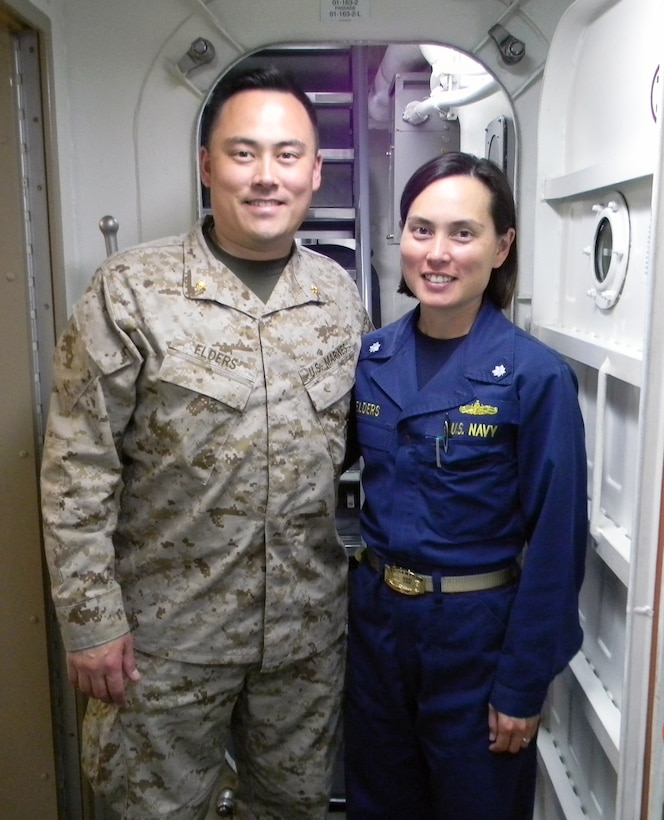 Maj. Thomas Elders, left, takes a picture with his sister, Cmdr. Teresa Elders, on the USS Sampson during a visit together as their ships passed each other in the Red Sea, May 24, 2012. Maj. Elders is the assistant operations officer for the 24th Marine Expeditionary Unit currently deployed on the amphibious assault ship USS Iwo Jima, and was able to fly over to visit his sister with other Marines and sailors touring the USS Sampson where Cmdr. Elders is serving as the executive officer. The Swedesboro, N.J., natives are on regularly scheduled deployments with their respective ships to the U.S. 5th Fleet Area of Responsibility.