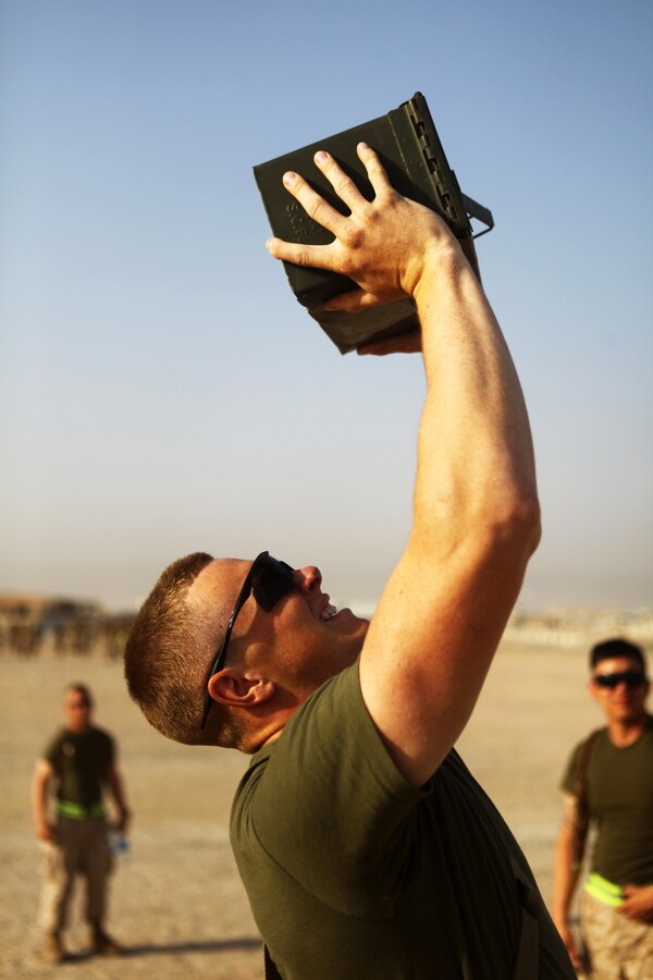 Cpl. Phil Pelletier, a squad leader with Weapons Company, Battalion Landing Team 1st Battalion, 2nd Marine Regiment, 24th Marine Expeditionary Unit, lifts an ammunition can as part of a BLT Independence Day Warrior Challenge aboard Camp Buehring, Kuwait, July 4, 2012. The 24th MEU is deployed as part of the Iwo Jima Amphibious Ready Group, a U.S. Central Command theater reserve force providing support for maritime security operations and theater security cooperation efforts in the U.S. 5th Fleet area of responsibility.