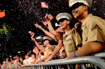 Marines and Bostonians react to the performance of the Boston Pops Fireworks Spectacular during Boston Navy Week. This celebration is one of 15 signature events planned across America in 2012. The eight-day long event commemorates the Bicentennial of the War of 1812, hosting service members from the U.S. Navy, Marine Corps and Coast Guard and coalition ships from around the world.