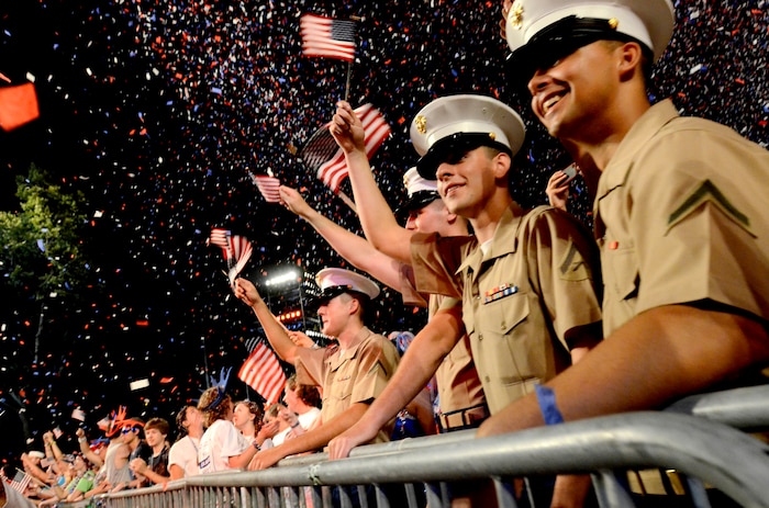 Marines and Bostonians react to the performance of the Boston Pops Fireworks Spectacular during Boston Navy Week. This celebration is one of 15 signature events planned across America in 2012. The eight-day long event commemorates the Bicentennial of the War of 1812, hosting service members from the U.S. Navy, Marine Corps and Coast Guard and coalition ships from around the world.