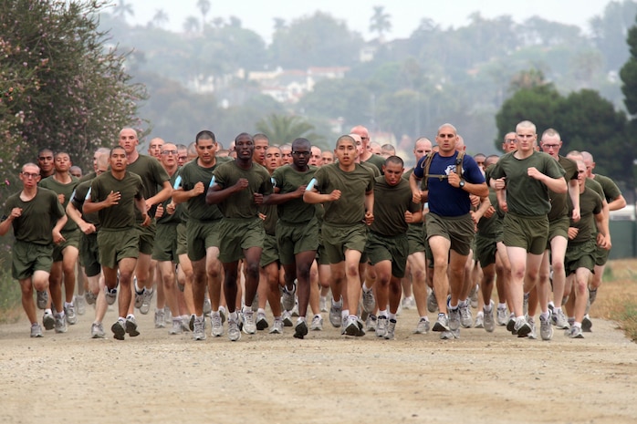 Recruits run at a drill instructor's set pace for a two-mile run July 12 aboard Marine Corps Recruit Depot San Diego. Recruits are split into ability groups based on their initial strength test run time. The ability groups are designed to build up strength and endurance so the recruits can improve their run for their initial physical fitness test scheduled July 20.