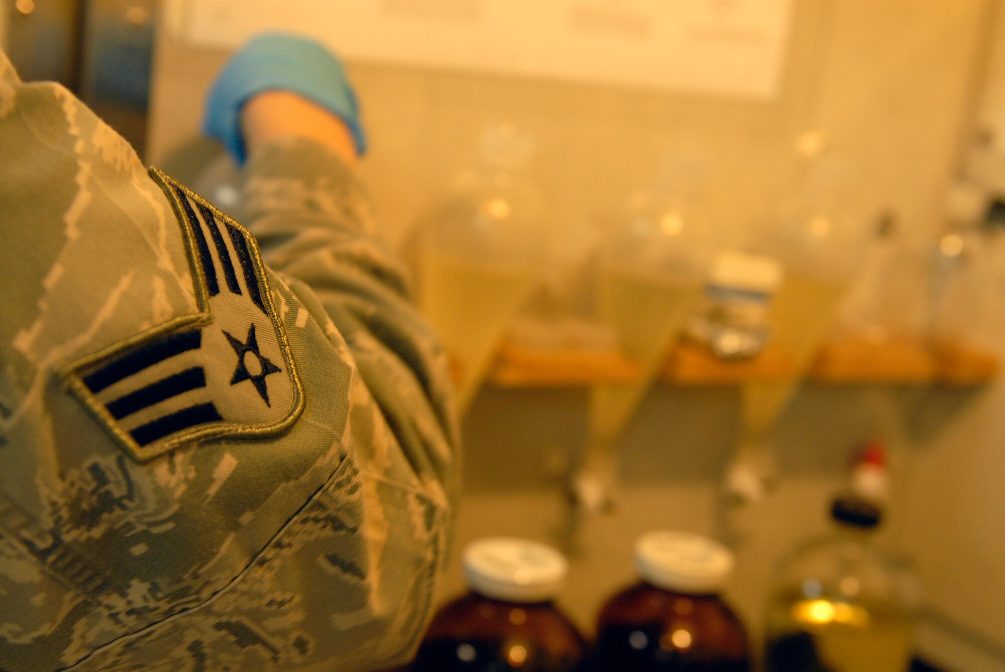 Senior Airman Rachal Eastwood, 18th Logistics Readiness Squadron fuels lab technician, tests for the quantity of ice inhibitors in the fuel on Kadena Air Base, Japan, July 11, 2012. The 18th LRS cryogenic section works with the hospital to provide oxygen for the patients. (U.S. Air Force photo/Airman 1st Class Malia Jenkins) 