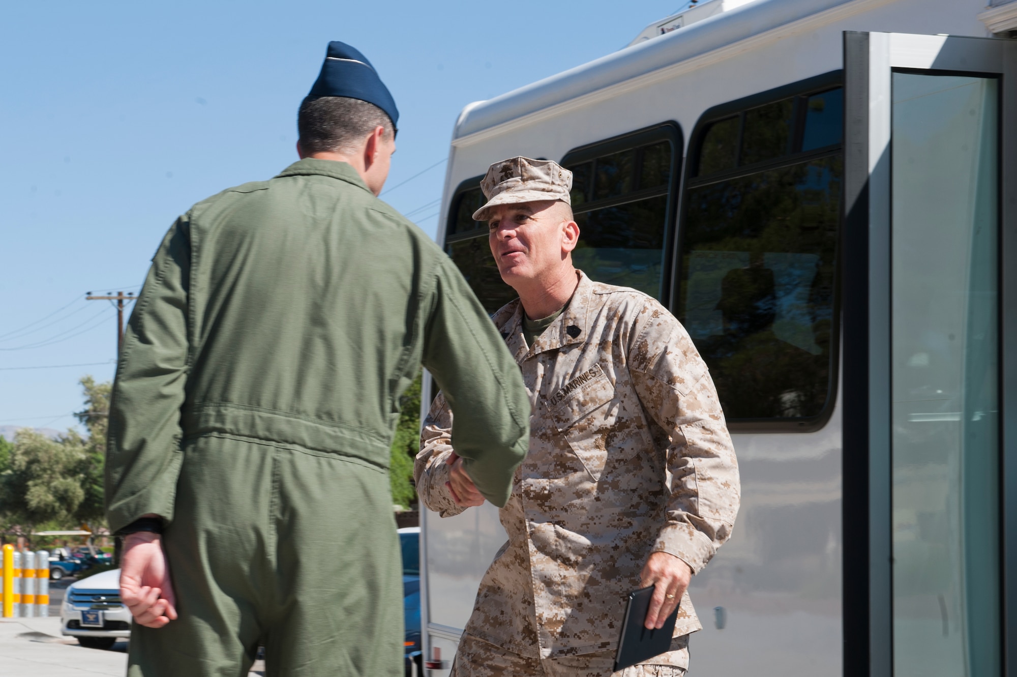 U.S. Marine Corps Sgt. Maj. Bryan Battaglia, Senior Enlisted Advisor to the Joint Chiefs of Staff, is greeted by Col. Alexus Grynkewich, 57th Wing vice commander,  July 9, 2012, at Nellis Air Force Base, Nev. Battaglia visited the 57th Wing, 99th Air Base Wing, Airman Leadership School, and the base theater to speak with Airmen and senior leadership.
(U.S. Air Force photo by Airman 1st Class Jason Couillard)