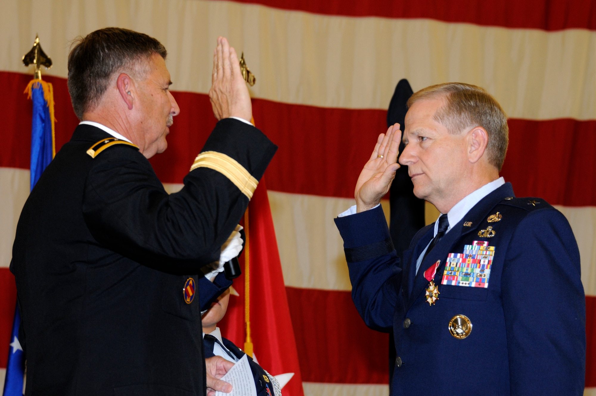 Maj. Gen. William Wofford, Arkansas National Guard adjutant general, left, administers the Oath of Office to Brig. Gen. Mark H. Berry July 15 at the 188th Fighter Wing during a promotion ceremony. Berry became the first officer from the 188th to be promoted to brigadier general in more than 25 years. Berry will serve as the Arkansas Air National Guard chief of staff. (National Guard photo by Airman Cody Martin/188th Fighter Wing Public Affairs)