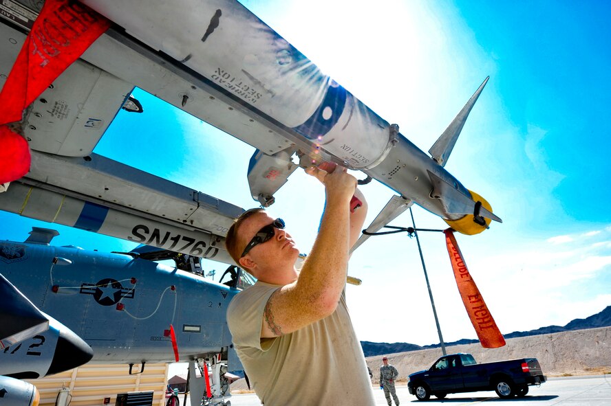 U.S. Air Force Senior Airman Adam Cybulski, 23d Aircraft Maintenance Squadron, 74th Aircraft Maintenance Unit weapons loader, performs a post load inspection during the Red Flag Exercise 12-4 at Nellis Air Force Base, Nev., July 16, 2012. A post load inspection is the last inspection done before the aircraft takes off. (U.S. Air Force photo by Staff Sgt. Stephanie Mancha/Released)
