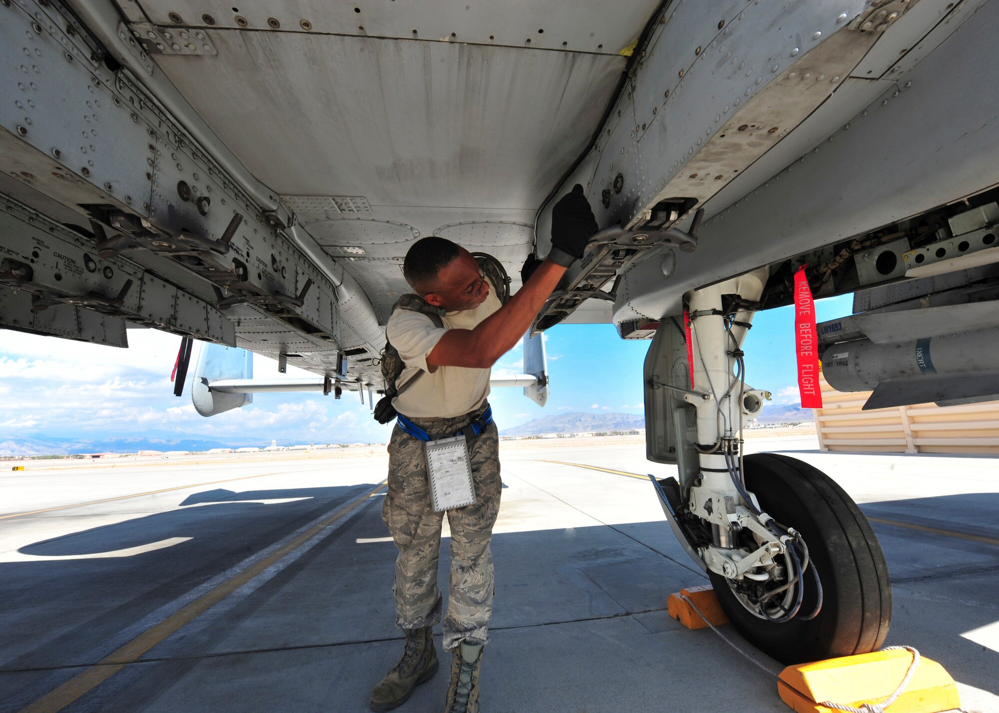 U.S. Air Force Staff Sgt. Ray Saunders, 23d Aircraft Maintenance Squadron, 74th Aircraft Maintenance Unit weapons loader, preforms a post load inspection during the Red Flag Exercise 12-4 at Nellis Air Force Base, Nev., July 16, 2012. Saunders has participated in several Red Flag exercises and will help train younger Airmen through this experience. (U.S. Air Force photo by Staff Sgt. Stephanie Mancha/Released)