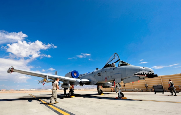 U.S. Air Force Airmen from the 74th Aircraft Maintenance Unit, 23d Aircraft Maintenance Squadron, load perform a post load inspection on an A-10C Thunderbolt II during the Red Flag Exercise 12-4 at Nellis Air Force Base, Nev., July 16, 2012. Red Flag is a realistic aerial combat training exercise that test the limits of man and machine as they conduct training on air interdiction, combat search and rescue, dynamic and high value targeting (U.S. Air Force photo by Staff Sgt. Stephanie Mancha/Released) 