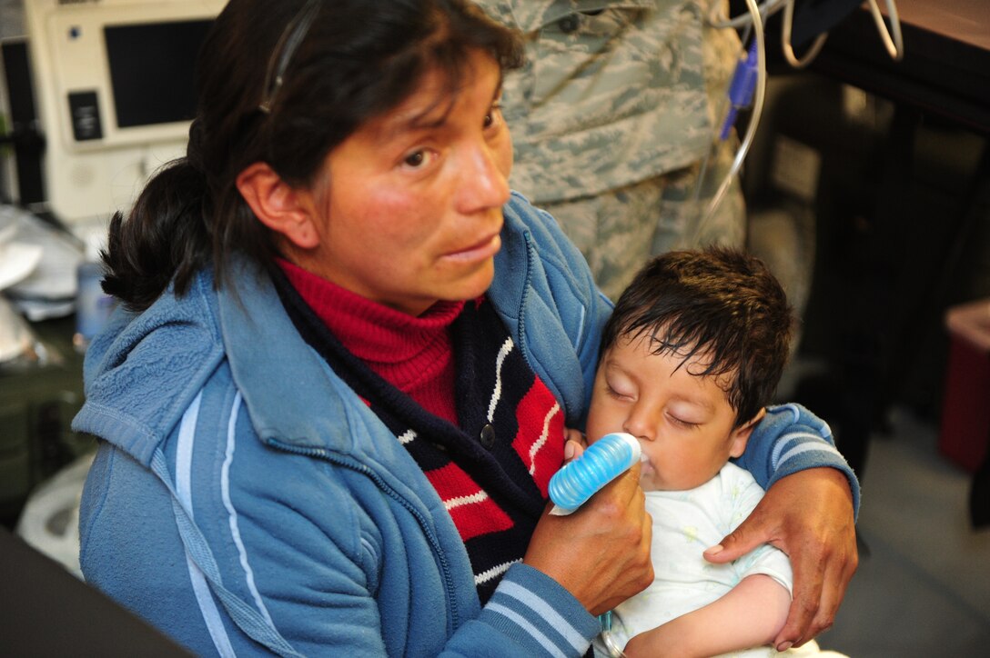 U.S. Air Force doctors and medics help a sick Peruvian boy at an expeditionary dental clinic in an Expeditionary Medical Support mobile field hospital in Huancavelica, Peru, July 3, 2012, as part of New Horizons 2012. New Horizons is a U.S. Southern Command-sponsored annual series of joint humanitarian assistance exercises deploying U.S. military engineers, veterinarians, medics and other professions to Central and South American nations for training, construction projects and to provide humanitarian and medical services. (U.S. Air Force photo by Staff Sgt. Michael C. Zimmerman/Released)

