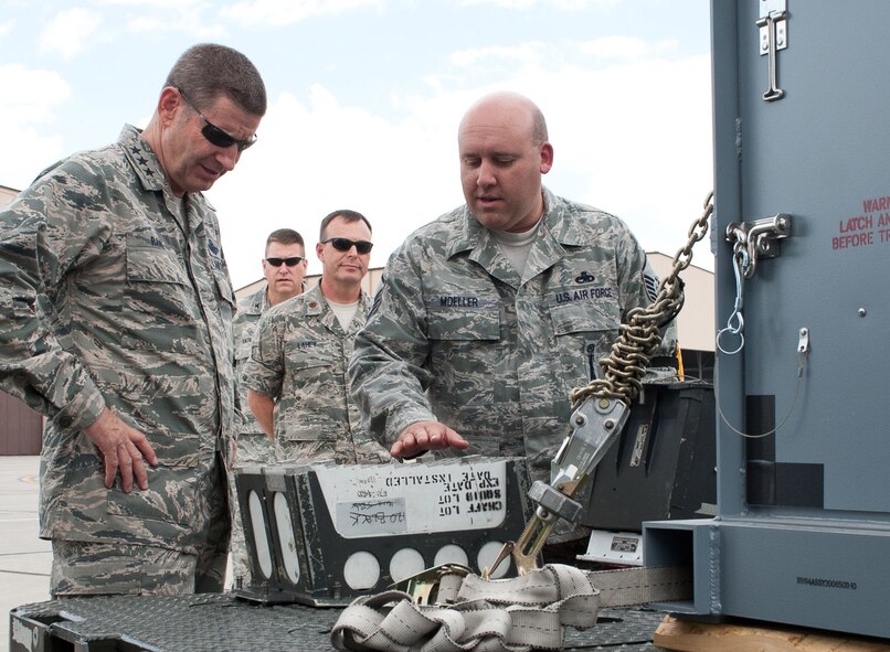 Master Sgt. Wade Moeller, 28th Munitions Squadron armament maintenance NCO in charge, explains B-1 bomber chaff and flare transport modules to Lt. Gen. Robin Rand, 12th Air Force commander, on the flightline during the general’s visit at Ellsworth Air Force Base, S.D., July 12, 2012. Rand toured all the bases under the 12th AF command to discuss mission priorities and gain insight to operational successes and shortfalls. (U.S. Air Force photo by Airman 1st Class Alystria Maurer) 