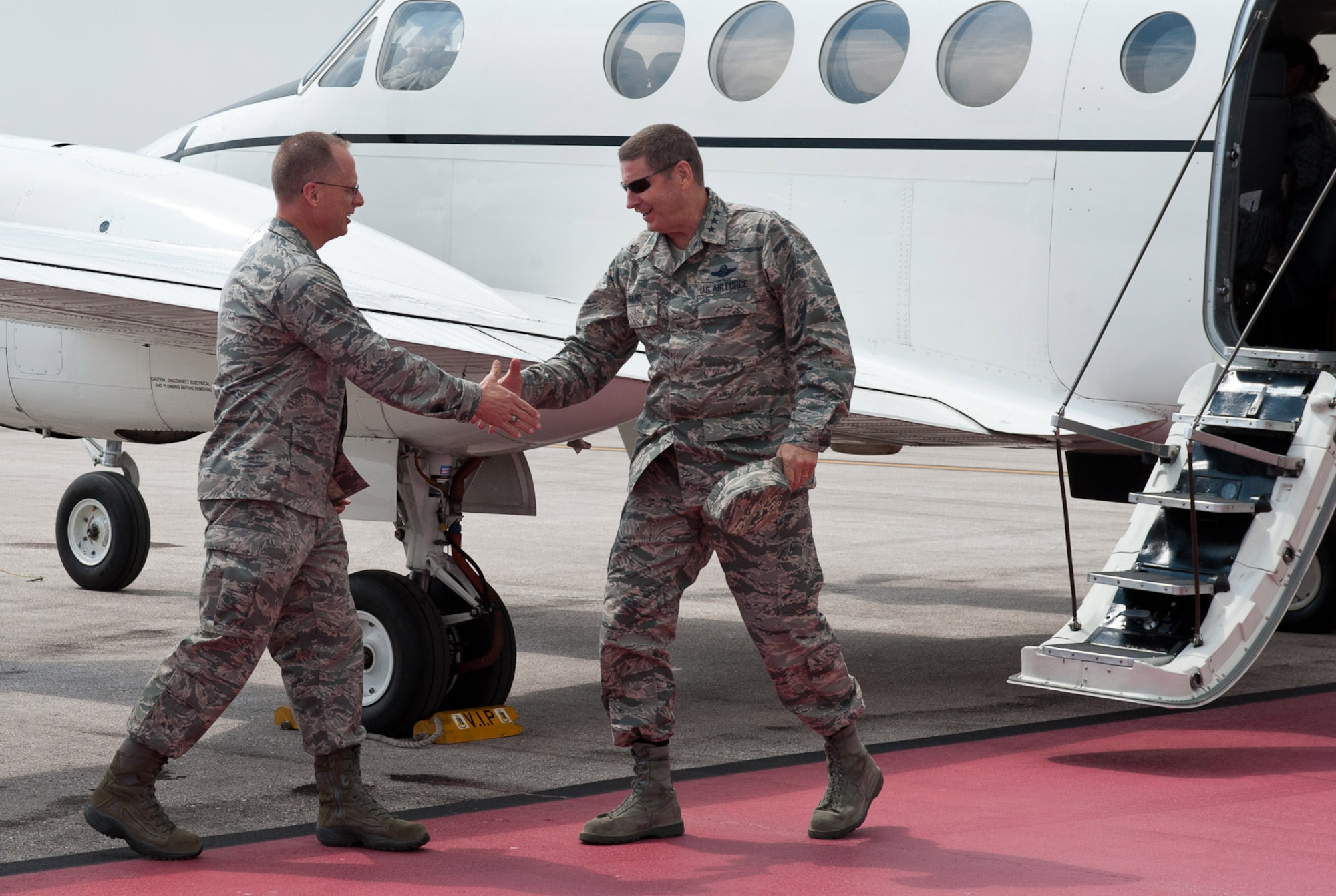 Col. Mark Weatherington, 28th Bomb Wing commander, welcomes Lt. Gen. Robin Rand, 12th Air Force commander, as he arrives at Ellsworth Air Force Base, S.D., July 12, 2012. Rand visited all the bases under the 12th AF umbrella to discuss mission priorities with Airmen and get a firsthand look of the work being accomplished. (U.S. Air Force photo by Airman 1st Class Alystria Maurer)