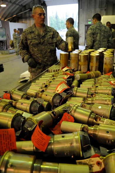 EIELSON AIR FORCE BASE, Alaska -- Senior Airman Brady Curtis-Quackenbush, munitions technician, builds bombs for a live-employment exercise with the  A-10 Thunderbolt II aircraft assigned to the 442nd Fighter Wing and deployed here for training. The munitions technicians are assigned to the 442nd Maintenance Squadron, part of the 442nd FW, Air Force Reserve unit at Whiteman Air Force Base, Mo. (U.S. Air Force photo/Staff Sgt. Danielle Johnston)