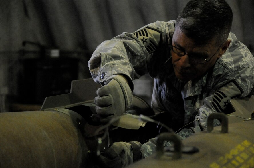 EIELSON AIR FORCE BASE, Alaska -- Master Sgt. Peter Kavanaugh, munitions technician, builds a Mark-82 for a live-employment exercise with the  A-10 Thunderbolt II aircraft assigned to the 442nd Fighter Wing and deployed here for training. The munitions technicians are assigned to the 442nd Maintenance Squadron, part of the 442nd FW, Air Force Reserve unit at Whiteman Air Force Base, Mo. (U.S. Air Force photo/Staff Sgt. Danielle Johnston)