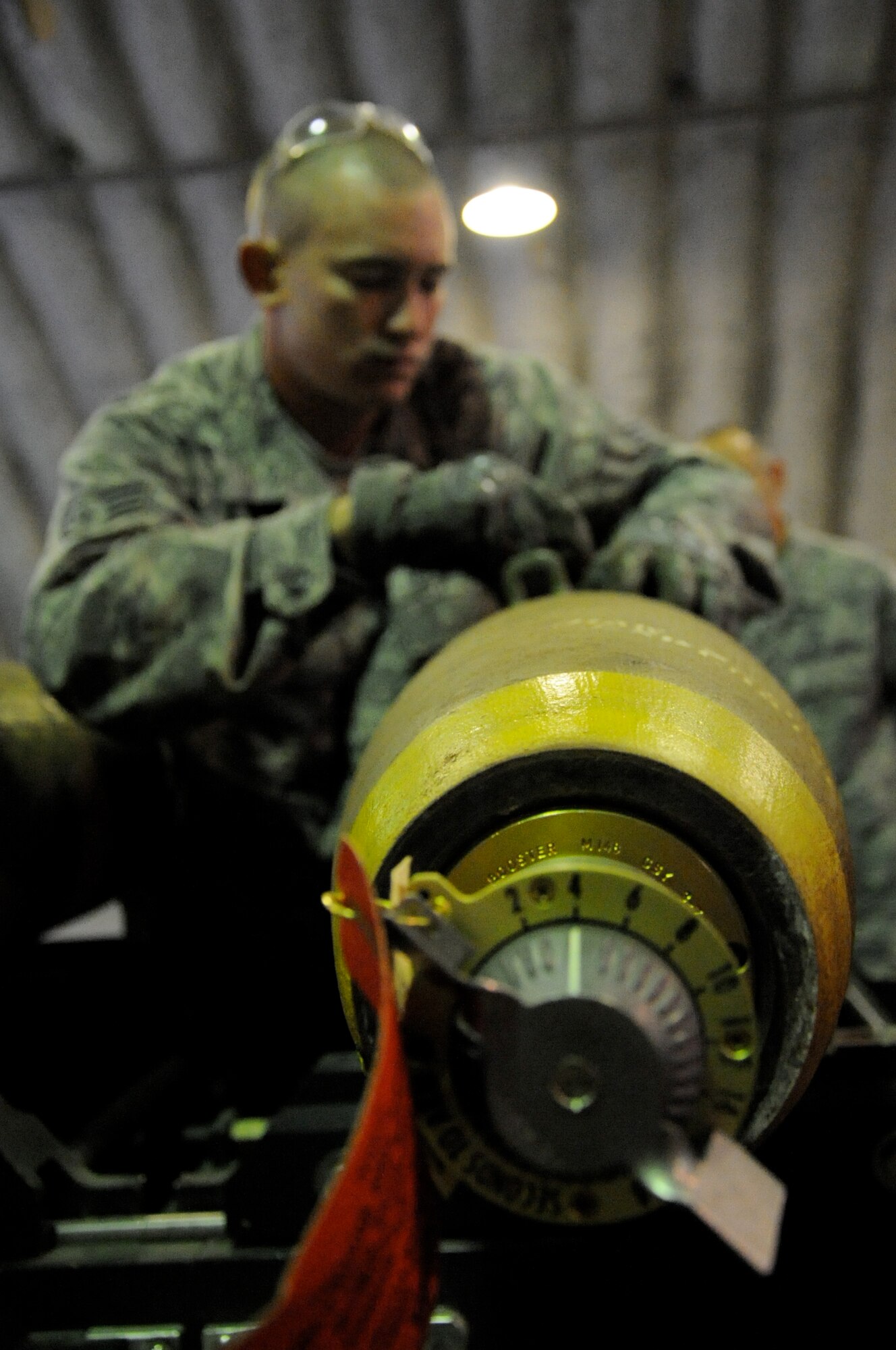 EIELSON AIR FORCE BASE, Alaska -- Senior Airman Brady Curtis-Quackenbush, munitions technician, builds a Mark-82 for a live-employment exercise with the  A-10 Thunderbolt II aircraft assigned to the 442nd Fighter Wing and deployed here for training. The munitions technicians are assigned to the 442nd Maintenance Squadron, part of the 442nd FW, Air Force Reserve unit at Whiteman Air Force Base, Mo. (U.S. Air Force photo/Staff Sgt. Danielle Johnston)