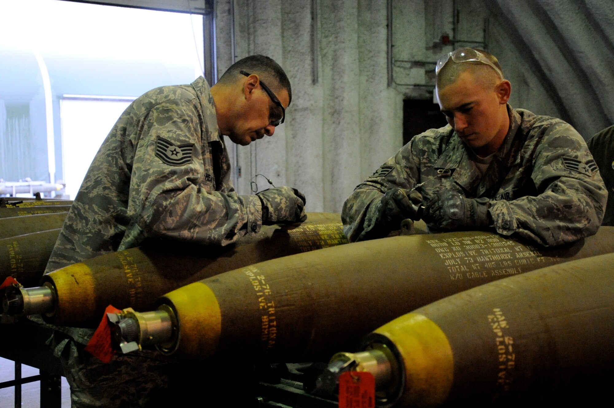 EIELSON AIR FORCE BASE, Alaska -- Tech. Sgt. James Head and Senior Airman Brady Curtis-Quackenbush, munitions technicians, build a Mark-82 for a live-employment exercise with the  A-10 Thunderbolt II aircraft assigned to the 442nd Fighter Wing and deployed here for training. The munitions technicians are assigned to the 442nd Maintenance Squadron, part of the 442nd FW, Air Force Reserve unit at Whiteman Air Force Base, Mo. (U.S. Air Force photo/Staff Sgt. Danielle Johnston)