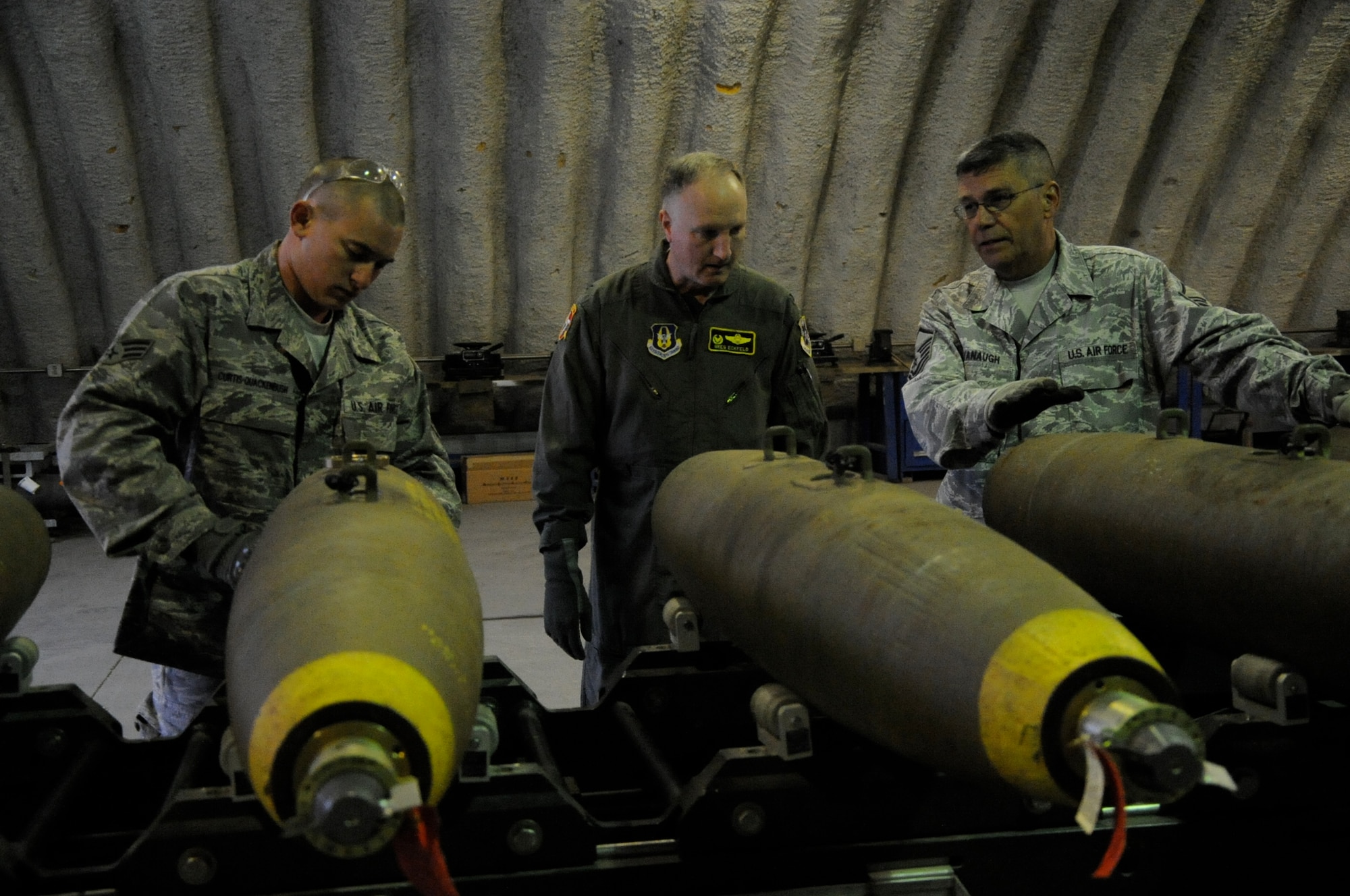 EIELSON AIR FORCE BASE, Alaska -- Senior Airman Brady Curtis-Quackenbush and Master Sgt. Peter Kavanaugh, munitions technicians, explain how to build a Mark-82 to Col. Gregory Eckfeld, 442nd Fighter Wing vice commander.  Eckfeld employs the Mark-82 when flying the A-10 Thunderbolt II aircraft assigned to the 442nd Fighter Wing and deployed here for training. The munitions technicians are assigned to the 442nd Maintenance Squadron, part of the 442nd FW, Air Force Reserve unit at Whiteman Air Force Base, Mo. (U.S. Air Force photo/Staff Sgt. Danielle Johnston)