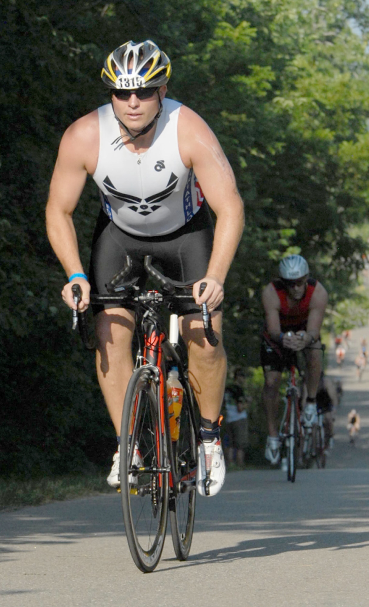Capt. David Wennerstrom, 442nd Civil Engineer Squadron assistant operations flight commander cycles during the second leg of the Iron Man 70.3 in Lawrence, Kan. June 20, 2012. Wennerstrom deployed to Afghanistan in 2011 where he began training for marathons and Iron Mans which entail: 2.5 miles swimming, 112 miles cycling and 26 miles running, within 17 hours. The 442nd CES is part of the 442nd Fighter Wing, an A-10 Thunderbolt II Air Force Reserve unit at Whiteman Air Force Base, Mo. (Courtesy photo/FinisherPix.com)