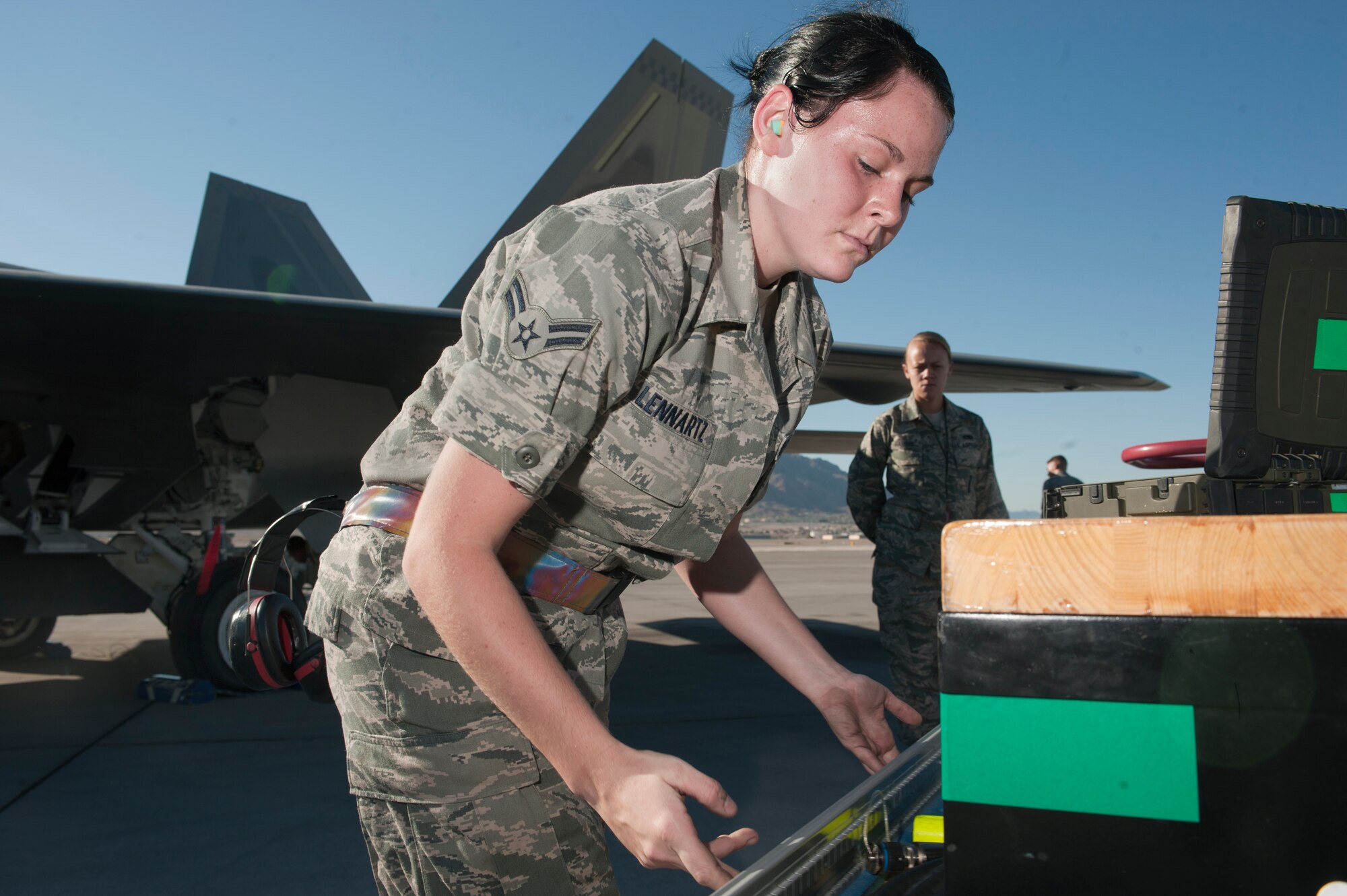 U.S. Air Force Airman 1st Class Stacey Lennartz checks over her composite tool kit during the quarterly load crew competition July 6, 2012, at Nellis Air Force Base, Nev.  Every team's CTK is inspected once they are done loading munitions. (U.S. Air Force photo by Airman 1st Class Jason Couillard)